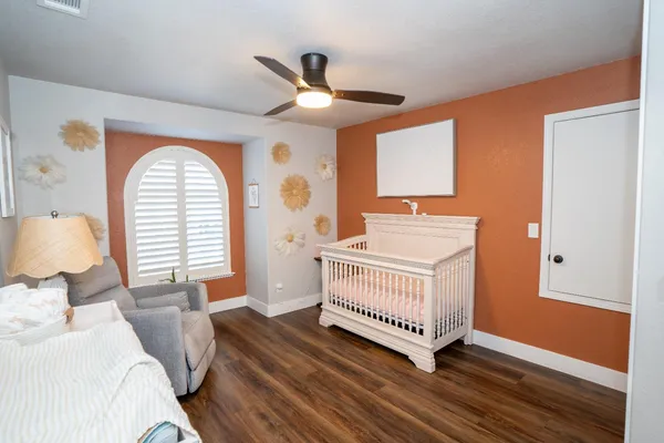 a bedroom with a bed and a window