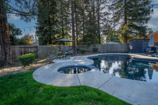 a view of a backyard with sitting area and furniture
