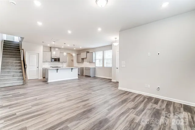 a view of kitchen with wooden floor