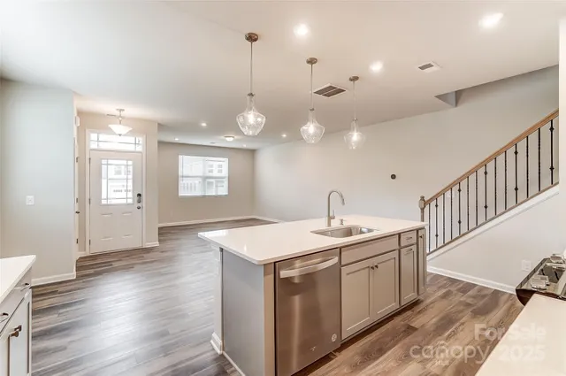 a kitchen with a sink and stove