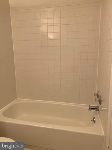 a view of a bathtub in a bathroom