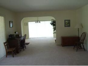 896 Ne Port Palm Bay, FL 32905 - Photo 3 of 9 a room with furniture and a window