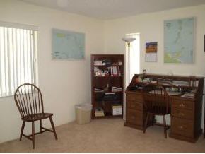 896 Ne Port Palm Bay, FL 32905 - Photo 9 of 9 a room with chairs and a window