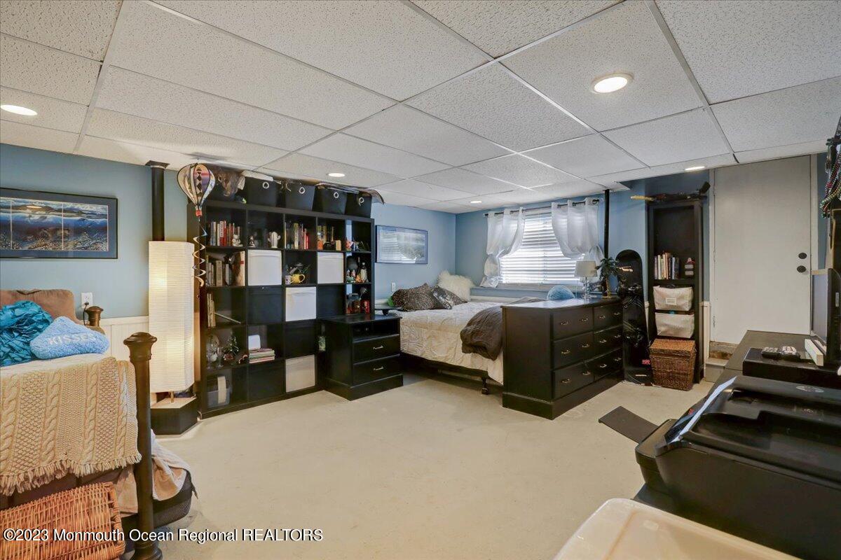 367 Middlewood Road Middletown, NJ 07748 - Photo 18 of 21 a bedroom with furniture and a gym equipment