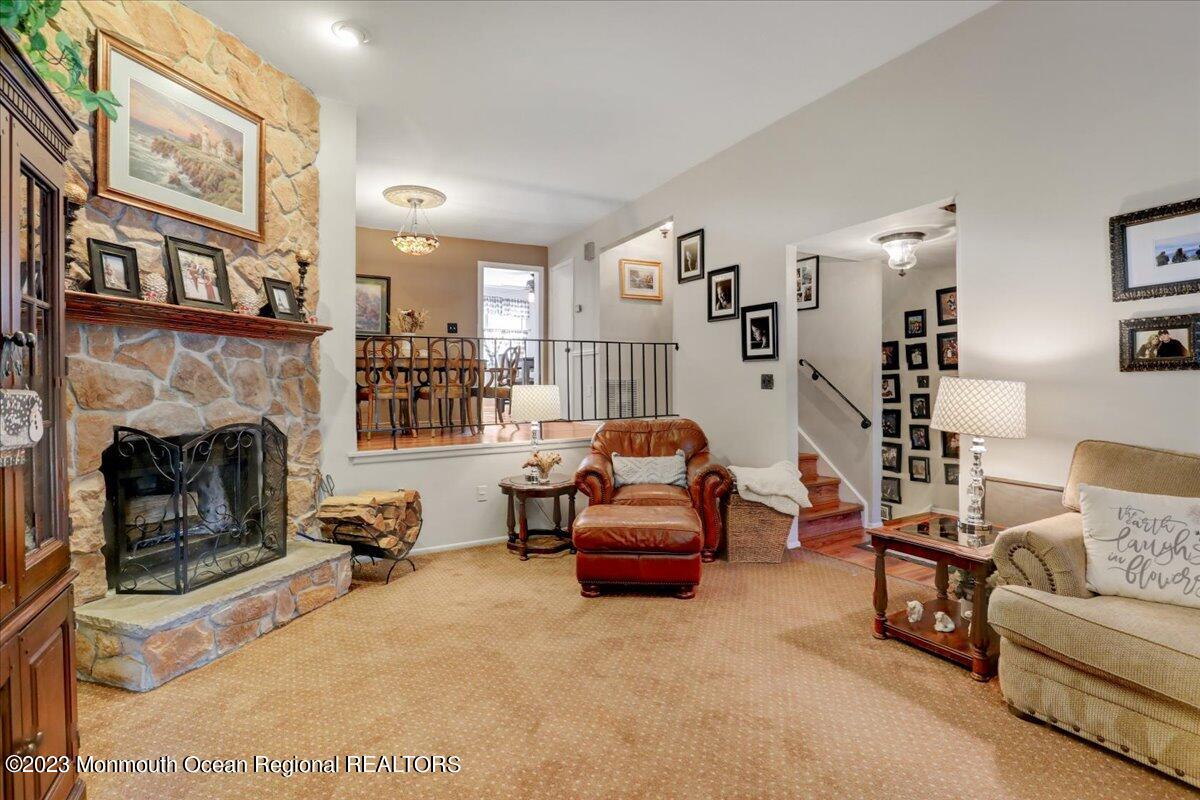 367 Middlewood Road Middletown, NJ 07748 - Photo 3 of 21 a living room with furniture and a fireplace