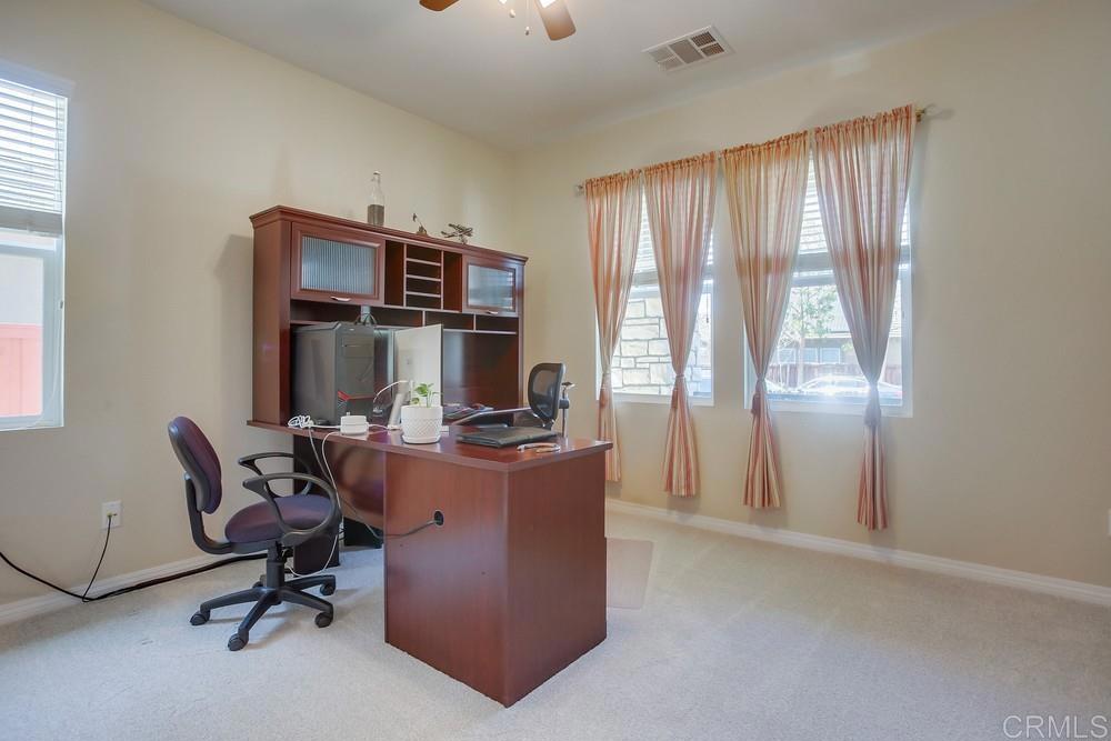 620 Key Lime Way Escondido, CA 92027 - Photo 17 of 24 a view of a workspace with furniture and a window