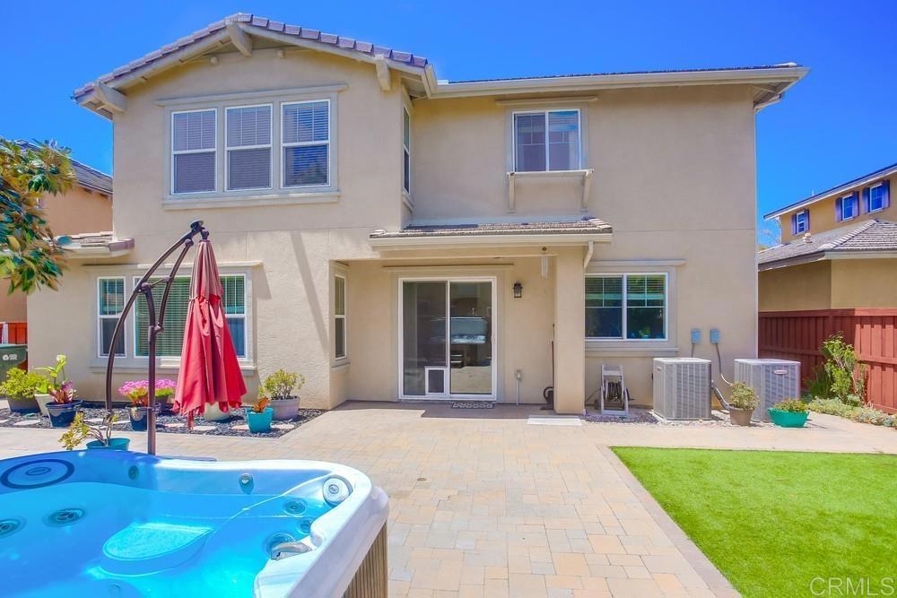 620 Key Lime Way Escondido, CA 92027 - Photo 21 of 24 a front view of building with door and outdoor seating