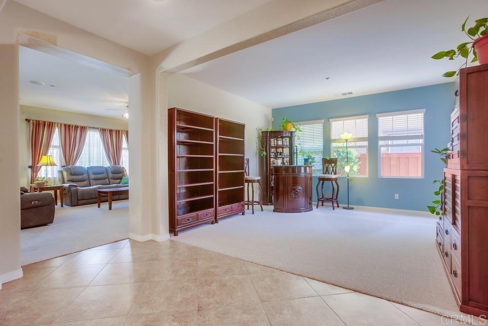 620 Key Lime Way Escondido, CA 92027 - Photo 4 of 24 a view of a livingroom with furniture and a potted plant