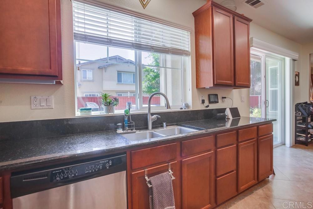 620 Key Lime Way Escondido, CA 92027 - Photo 7 of 24 a kitchen with a sink and a window