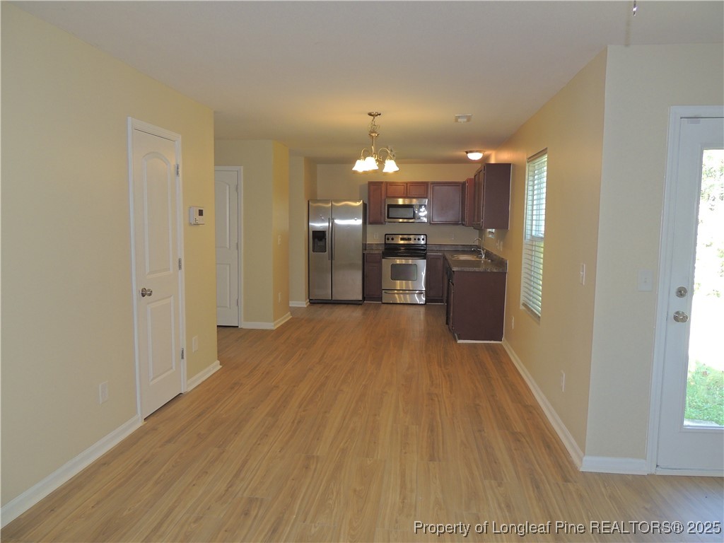 46 Hallow Oak Street Spring Lake, NC 28390 - Photo 3 of 22 a view of a kitchen with a sink and a refrigerator