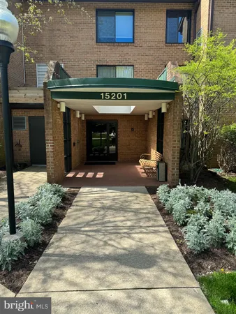 a front view of a building with garden
