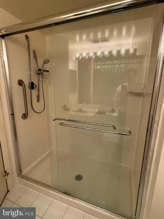 a bathroom with a glass shower door