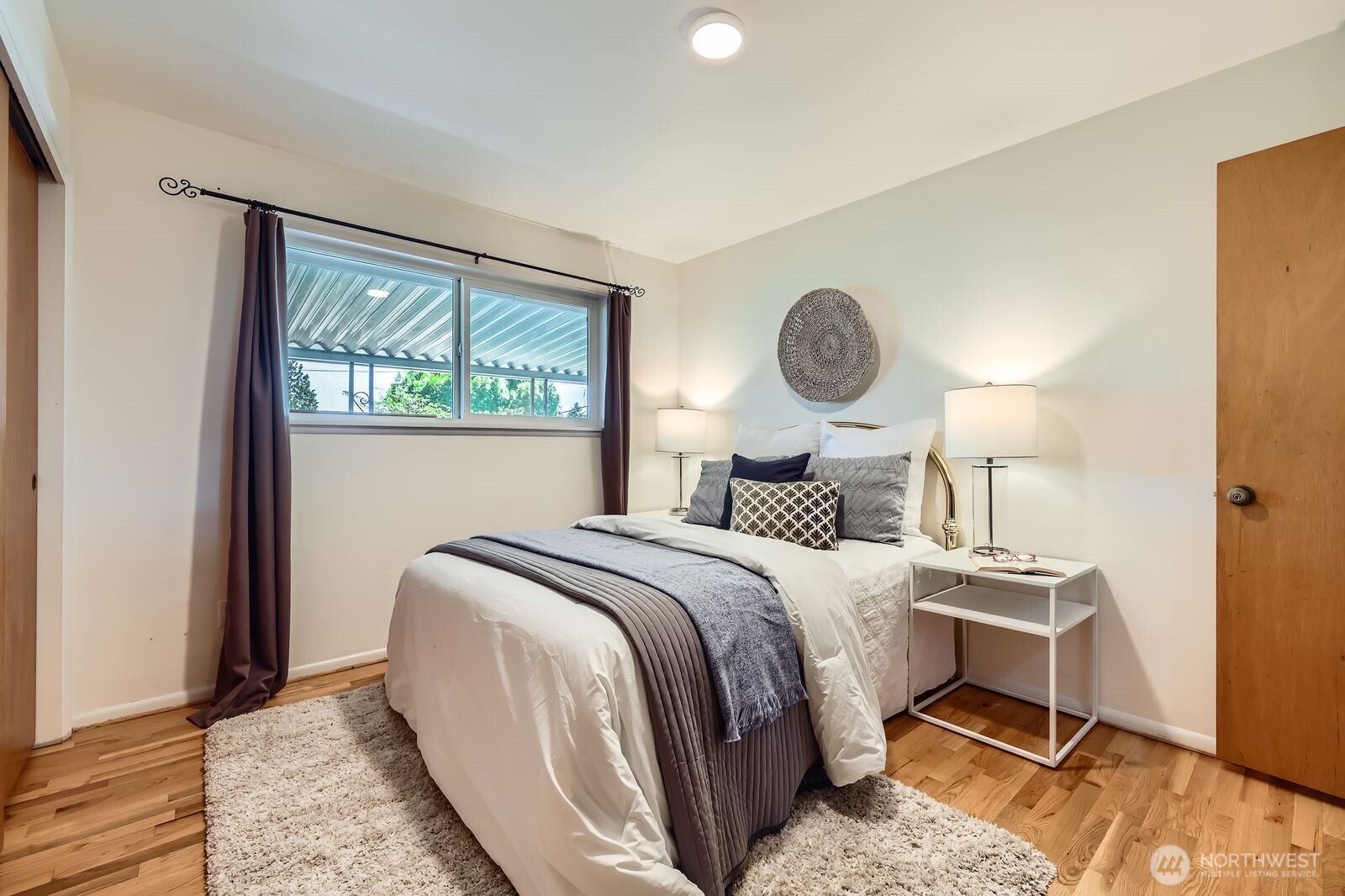 7924 South 112th Street Seattle, WA 98178 - Photo 14 of 40 a bedroom with a bed and a window