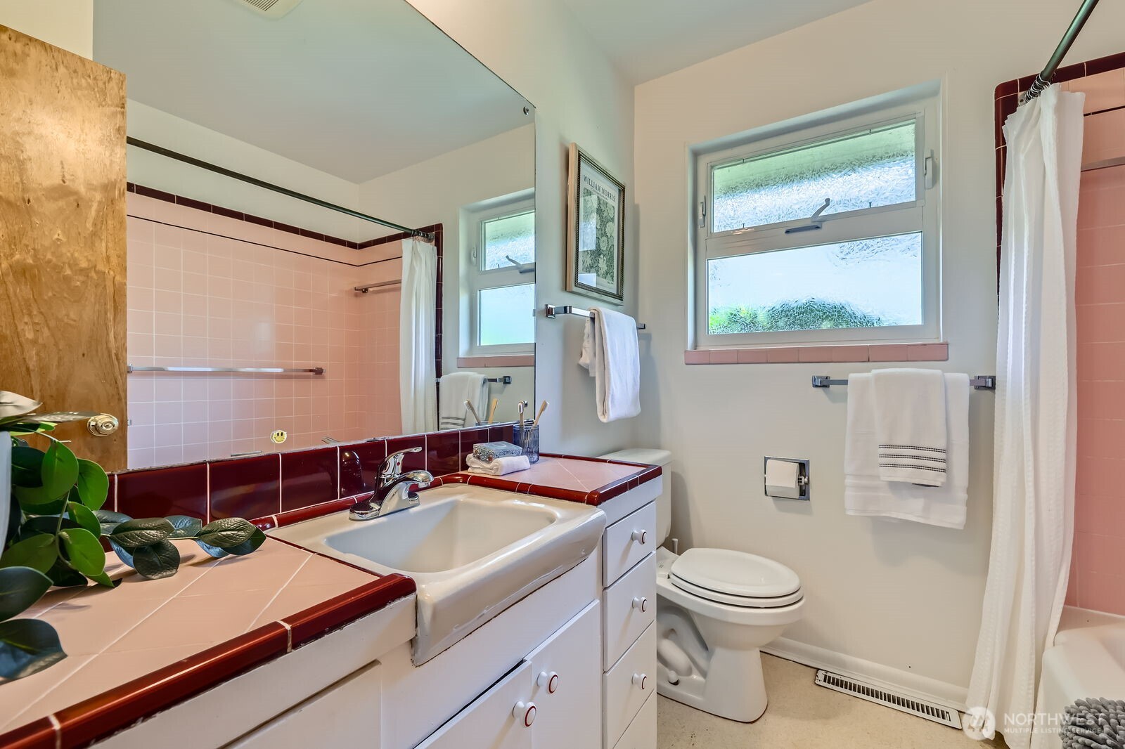 7924 South 112th Street Seattle, WA 98178 - Photo 16 of 40 a bathroom with a sink toilet vanity and mirror
