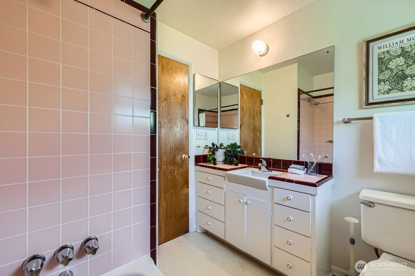 7924 South 112th Street Seattle, WA 98178 - Photo 17 of 40 a bathroom with a double vanity sink a mirror and a shower