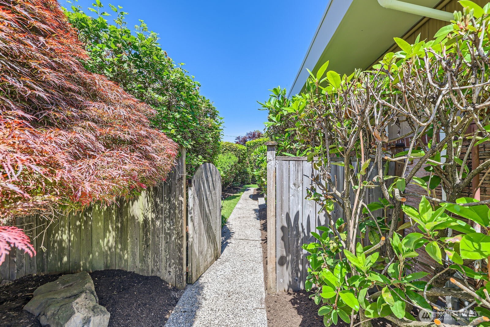 7924 South 112th Street Seattle, WA 98178 - Photo 2 of 40 a backyard of a house with lots of green space