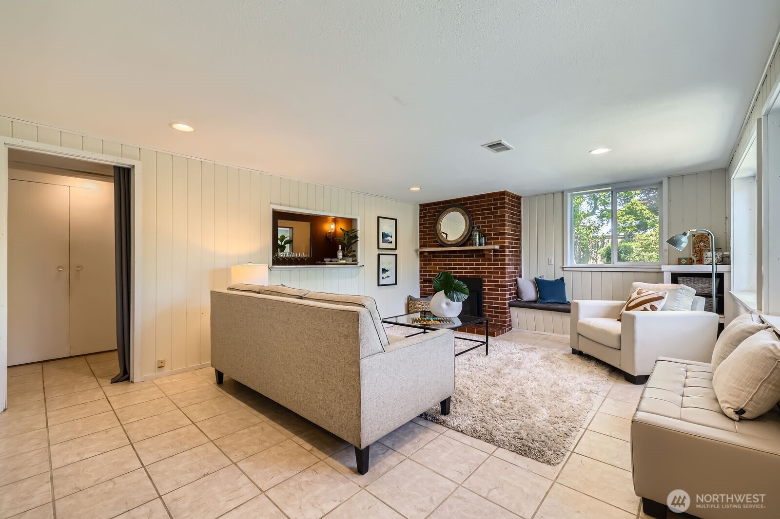 7924 South 112th Street Seattle, WA 98178 - Photo 23 of 40 a living room with furniture a flat screen tv and a fireplace
