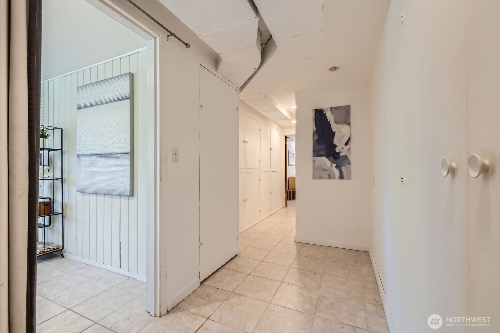 7924 South 112th Street Seattle, WA 98178 - Photo 25 of 40 a view of a hallway to rooms
