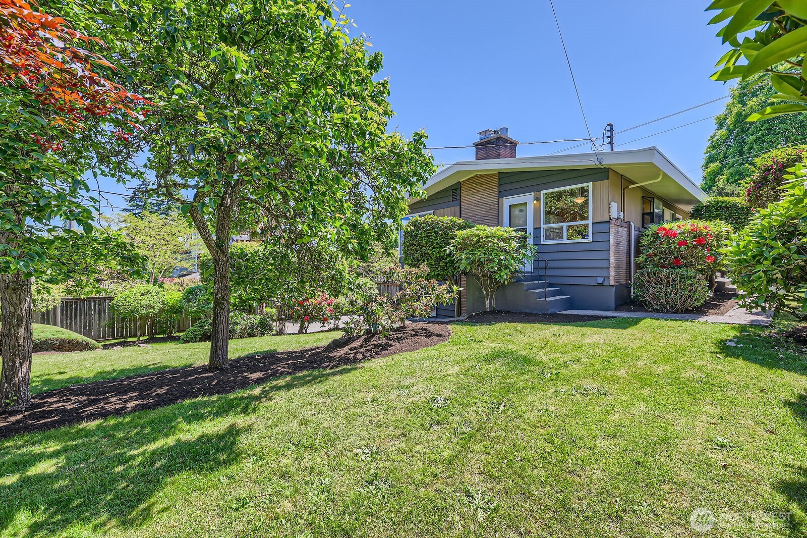 7924 South 112th Street Seattle, WA 98178 - Photo 36 of 40 a front view of a house with garden