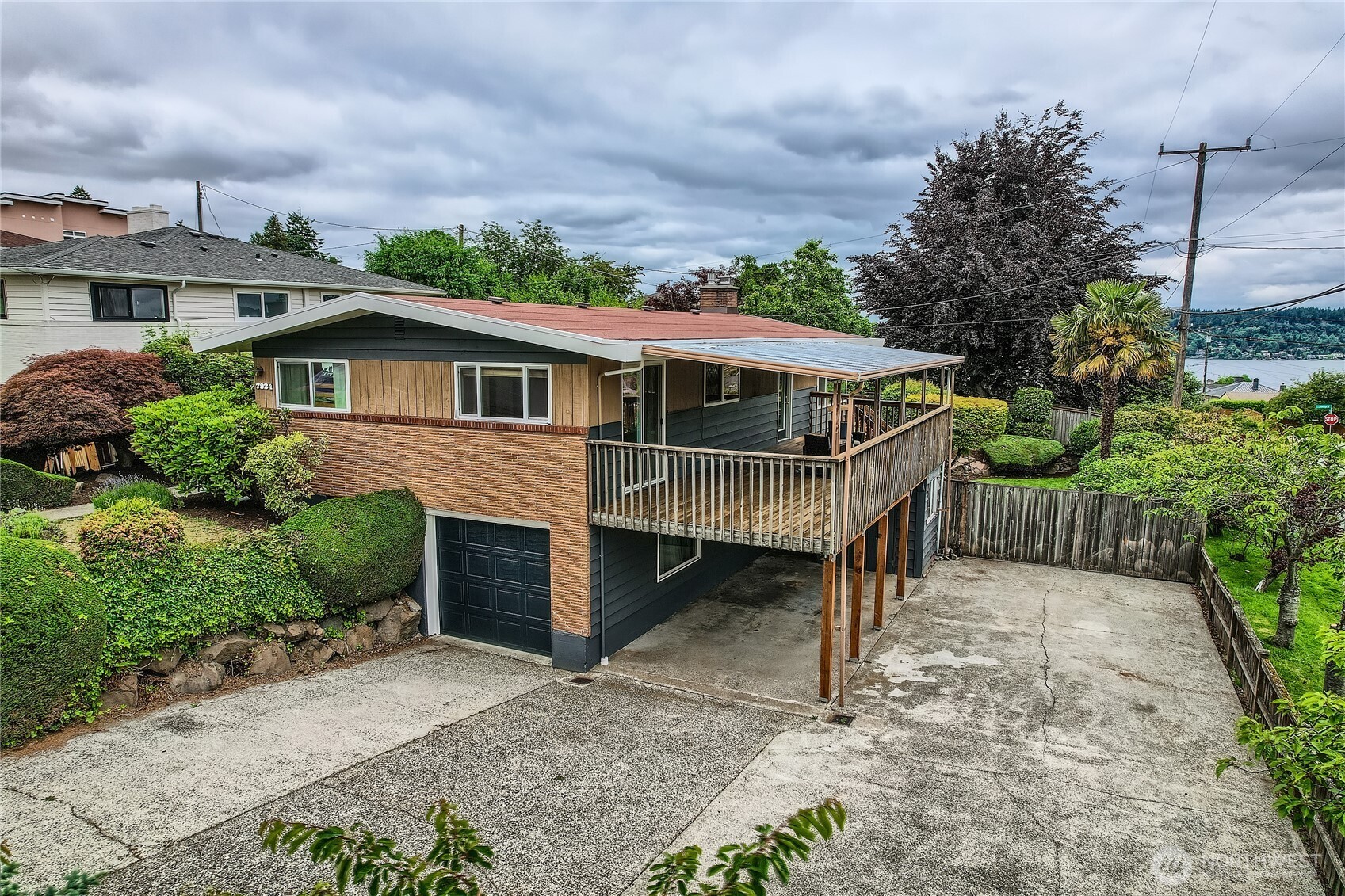 7924 South 112th Street Seattle, WA 98178 - Photo 39 of 40 a front view of a house with a yard and garage