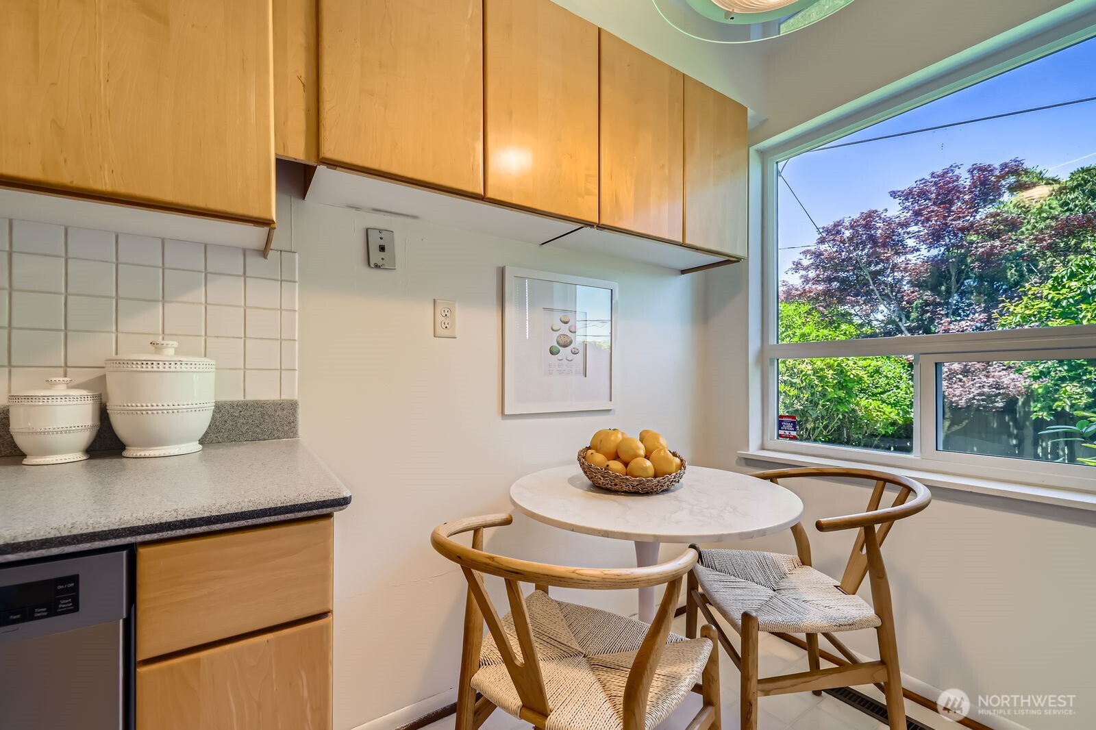 7924 South 112th Street Seattle, WA 98178 - Photo 10 of 40 a kitchen with a table chairs and a table