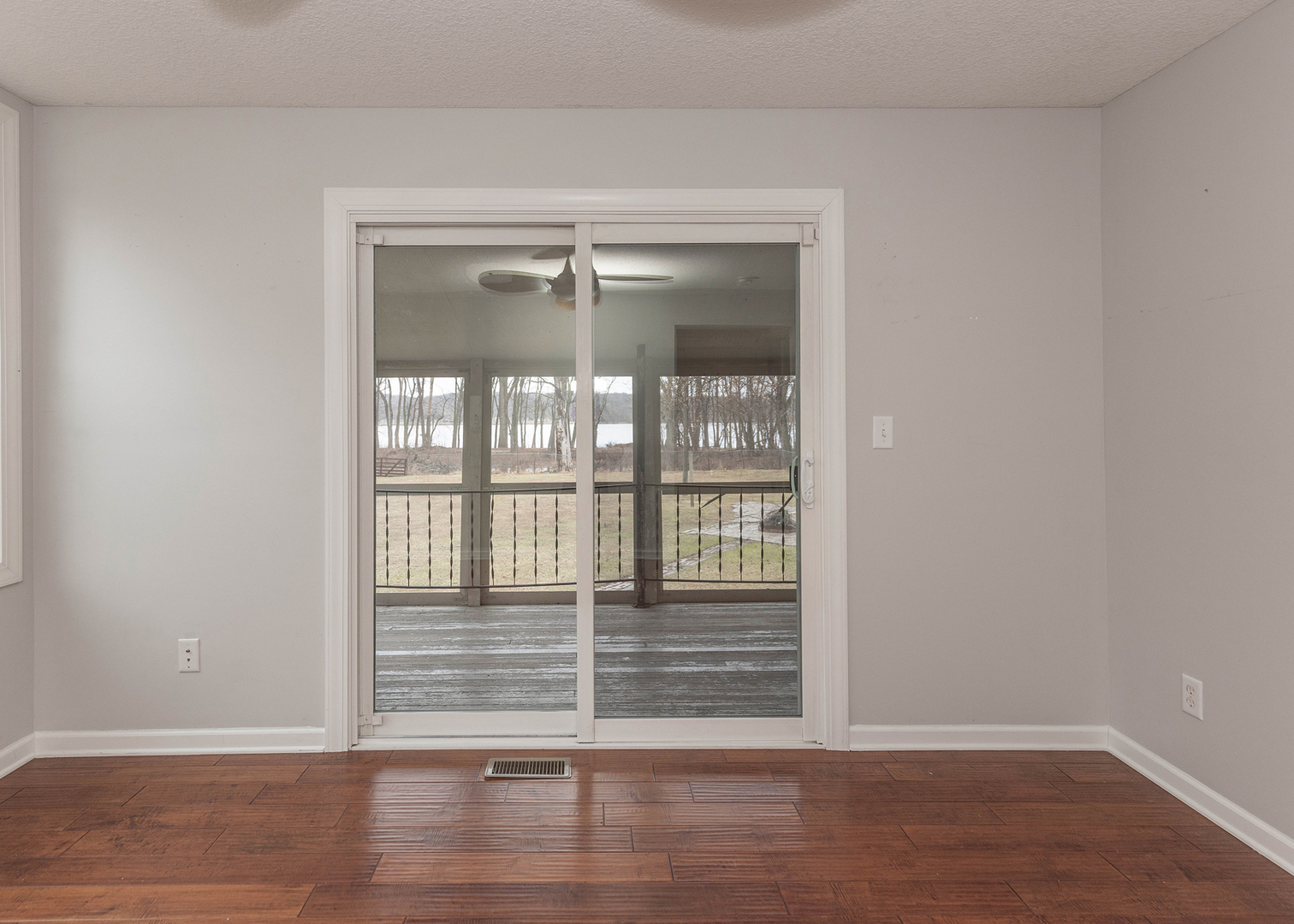 25199 182nd Street Pleasant Valley, IA 52767 - Photo 11 of 37 a view of empty room with wooden floor and fan