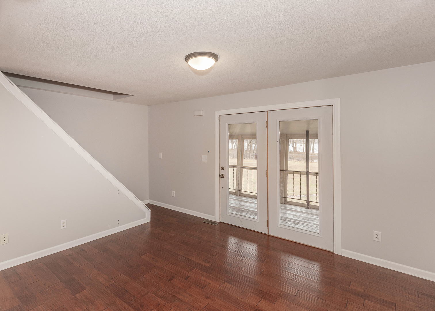 25199 182nd Street Pleasant Valley, IA 52767 - Photo 12 of 37 wooden floor and windows in an empty room