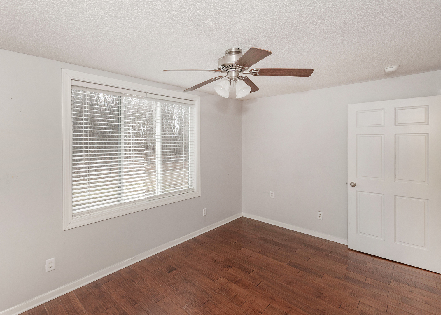 25199 182nd Street Pleasant Valley, IA 52767 - Photo 13 of 37 a view of a room with wooden floor and windows
