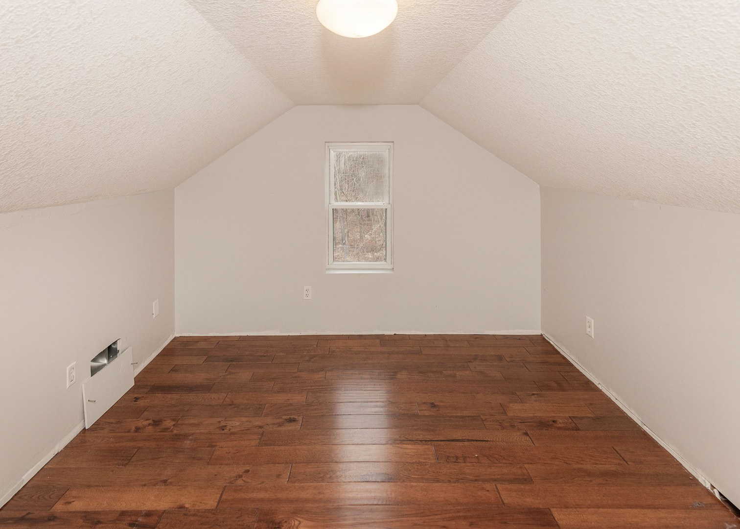 25199 182nd Street Pleasant Valley, IA 52767 - Photo 22 of 37 an empty room with wooden floor and windows