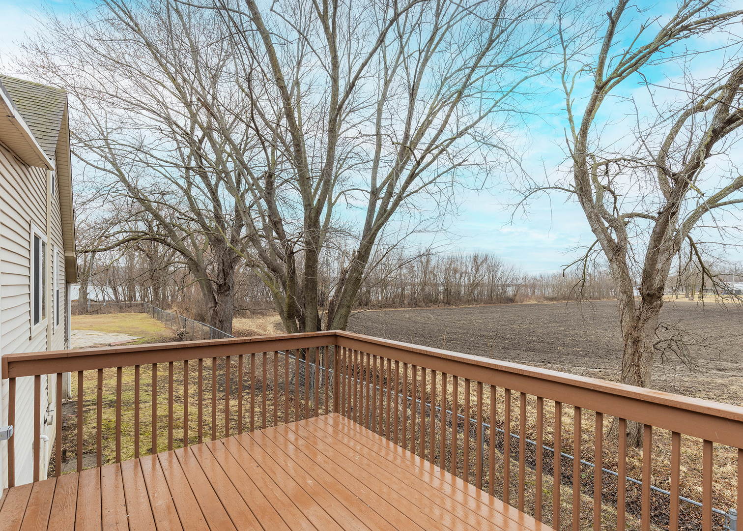 25199 182nd Street Pleasant Valley, IA 52767 - Photo 25 of 37 a view of balcony with wooden floor and fence