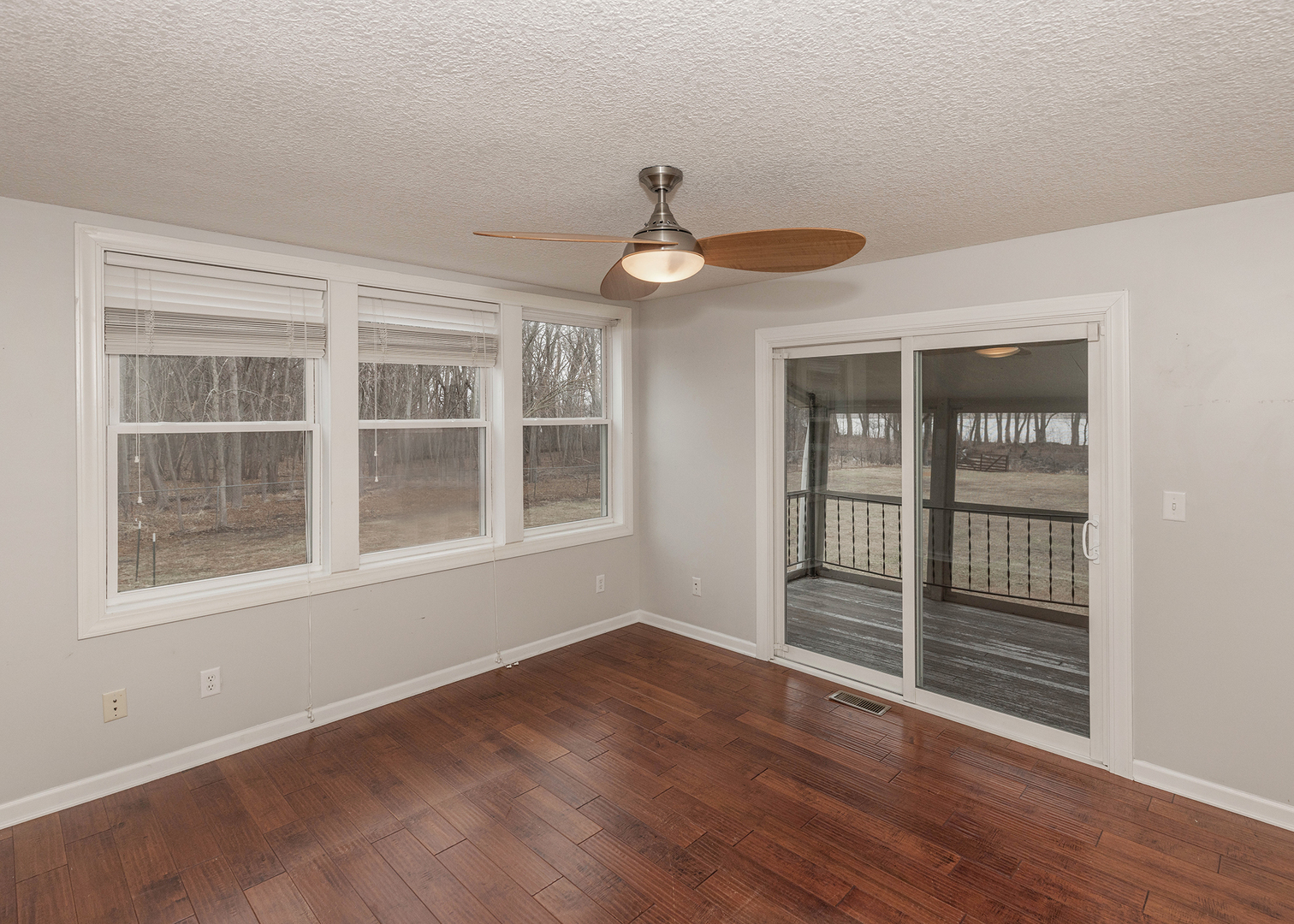 25199 182nd Street Pleasant Valley, IA 52767 - Photo 6 of 37 a view of an empty room with wooden floor and a window