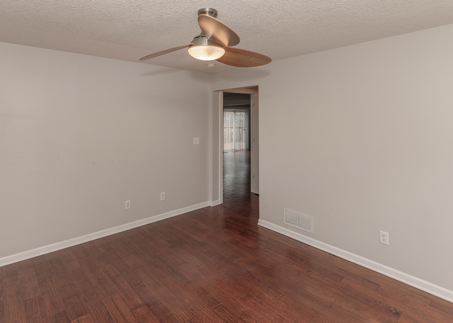 25199 182nd Street Pleasant Valley, IA 52767 - Photo 7 of 37 a view of an empty room with wooden floor