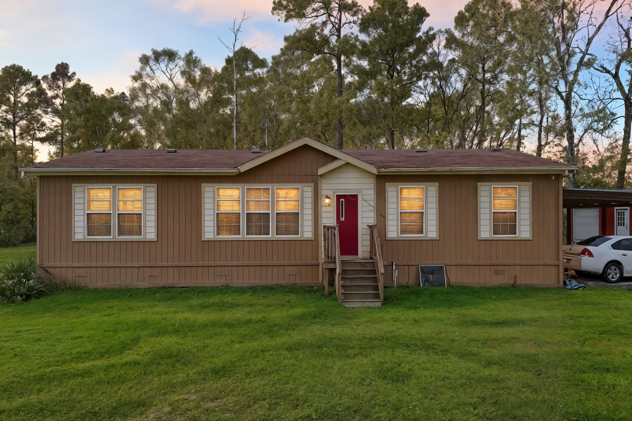 a front view of a house with a garden