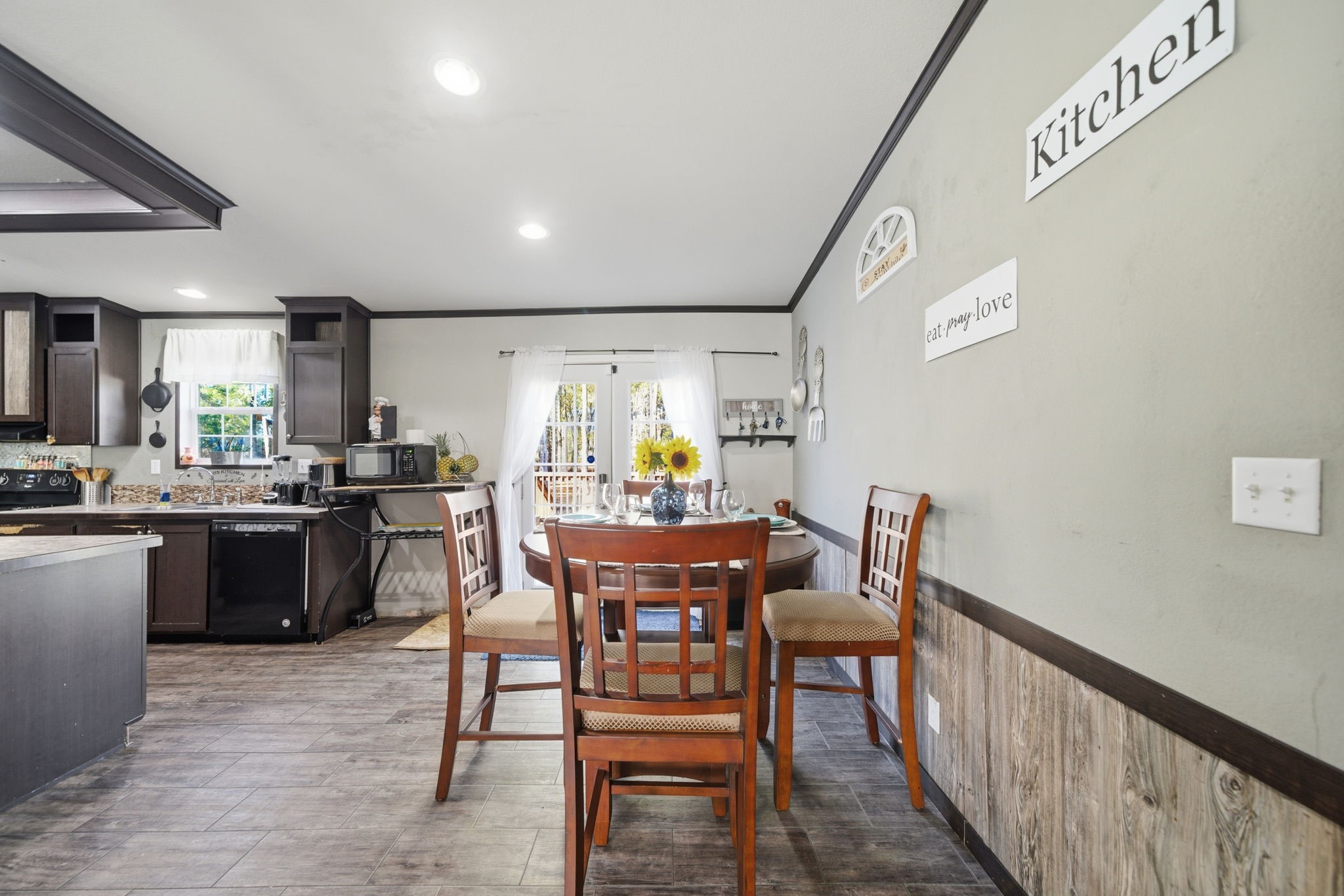 17028 Lively Road Waller, TX 77484 - Photo 5 of 20 a view of a dining room with furniture and wooden floor