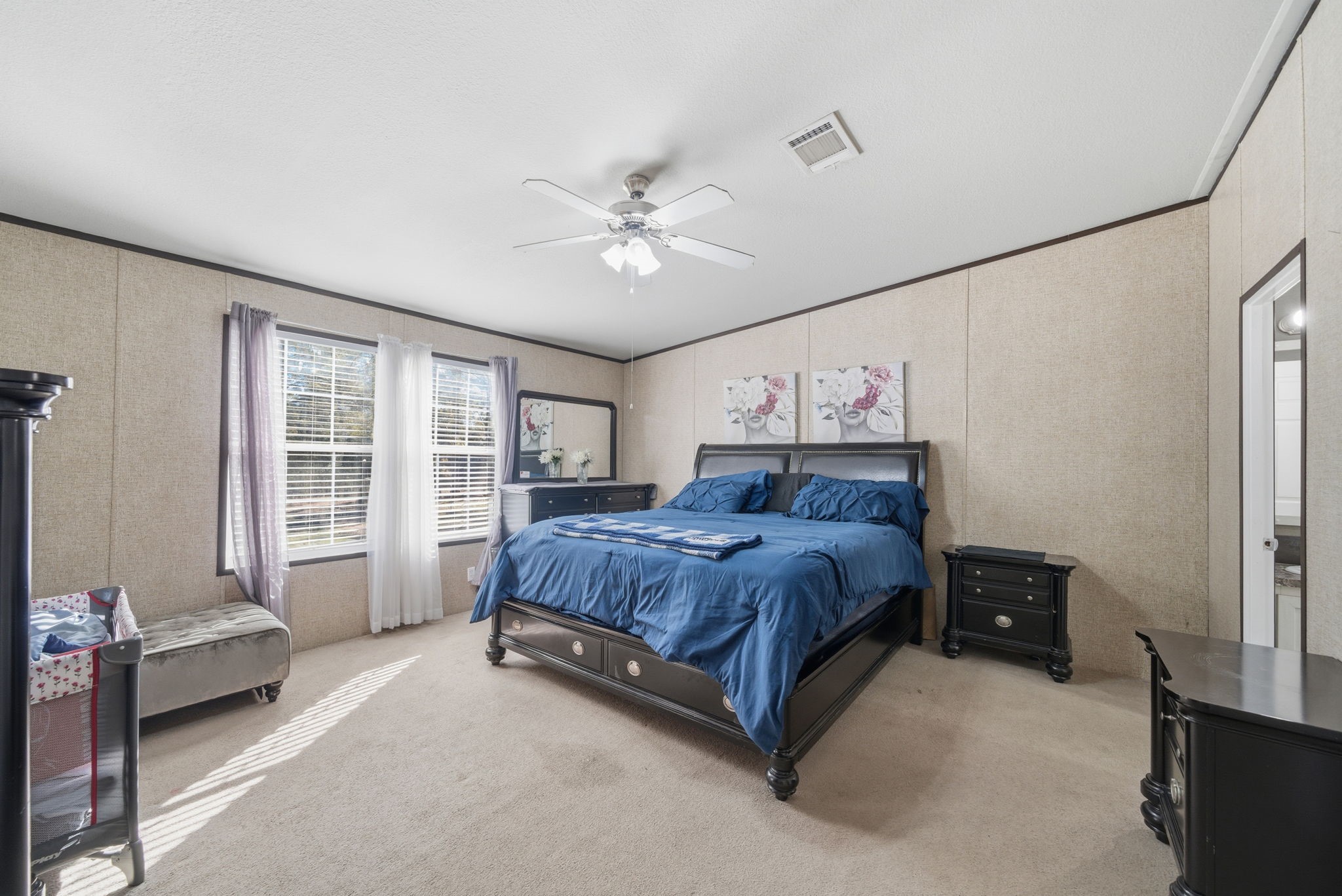 17028 Lively Road Waller, TX 77484 - Photo 20 of 20 a spacious bedroom with a bed and a large window