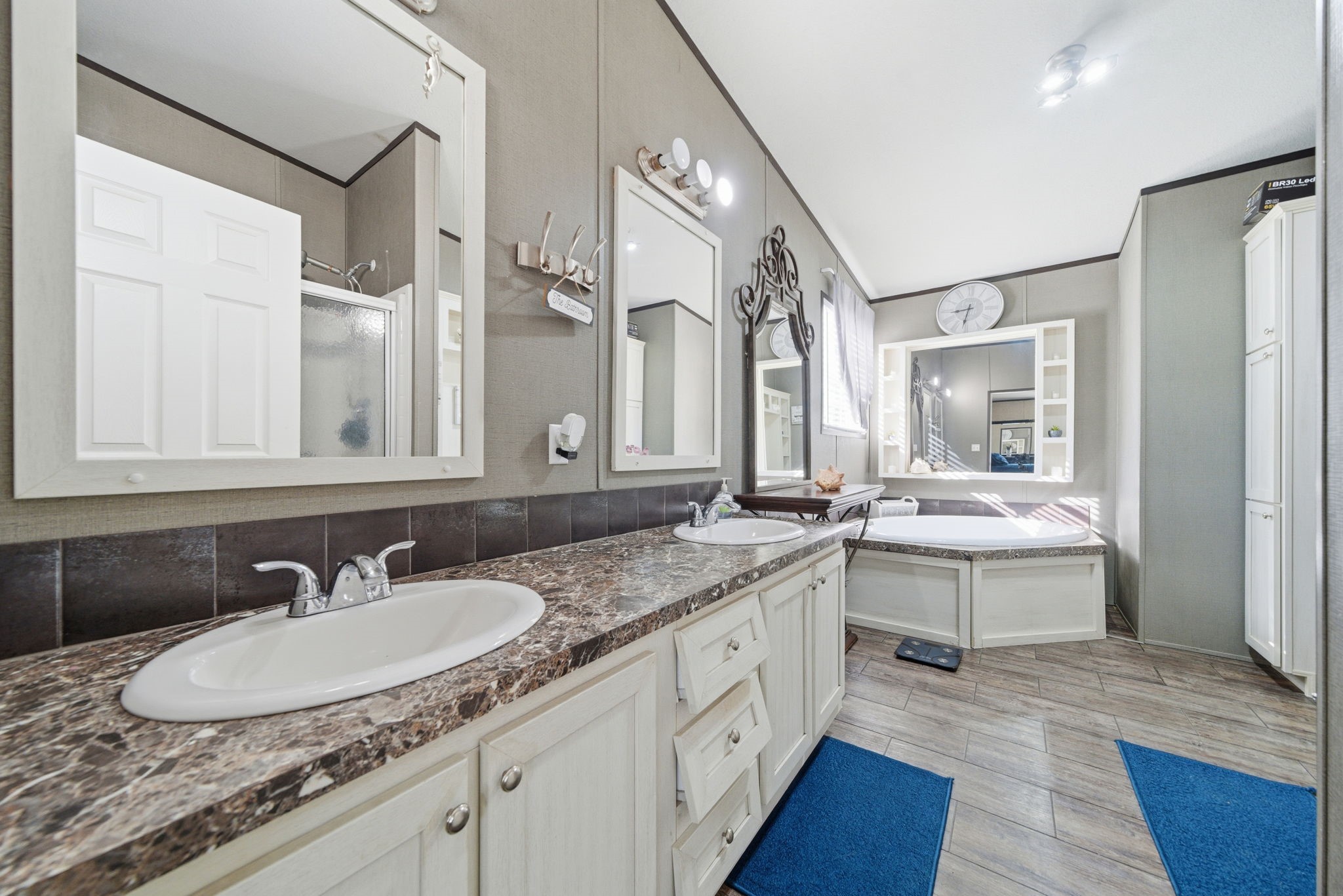 17028 Lively Road Waller, TX 77484 - Photo 6 of 20 a bathroom with a granite countertop sink and a mirror