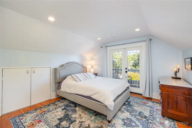 a bathroom with double vanity sink and a mirror