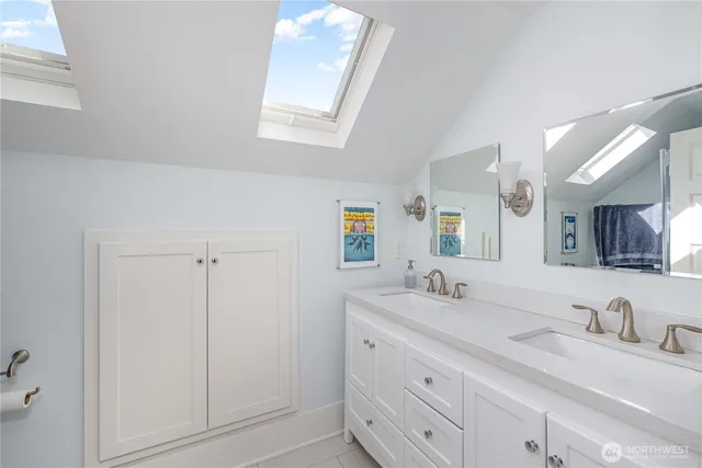 a kitchen with kitchen island granite countertop a sink and a stove