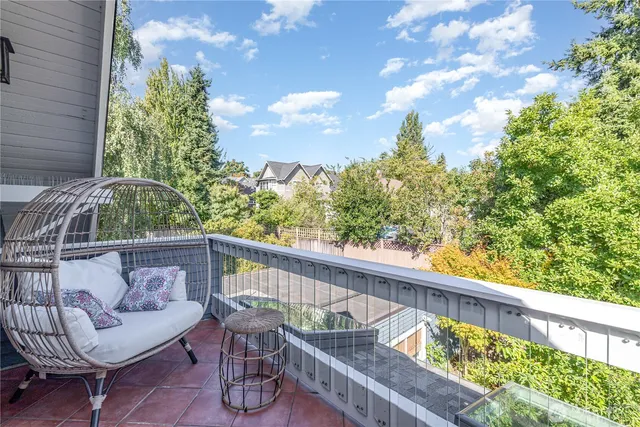 a view of a backyard with sitting area