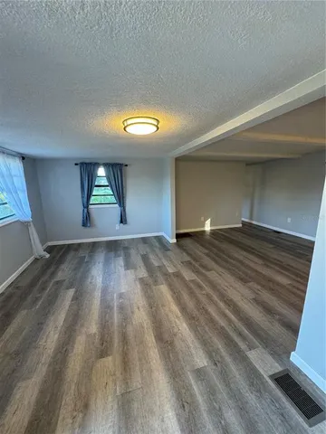 wooden floor in a room with a window