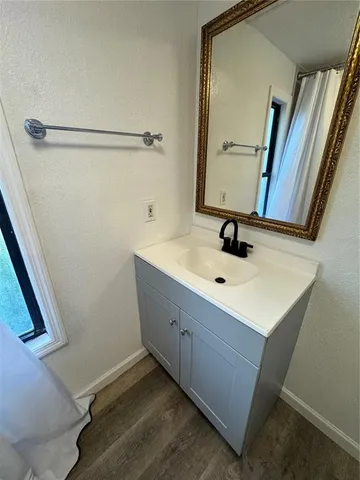 a bathroom with a sink and a mirror