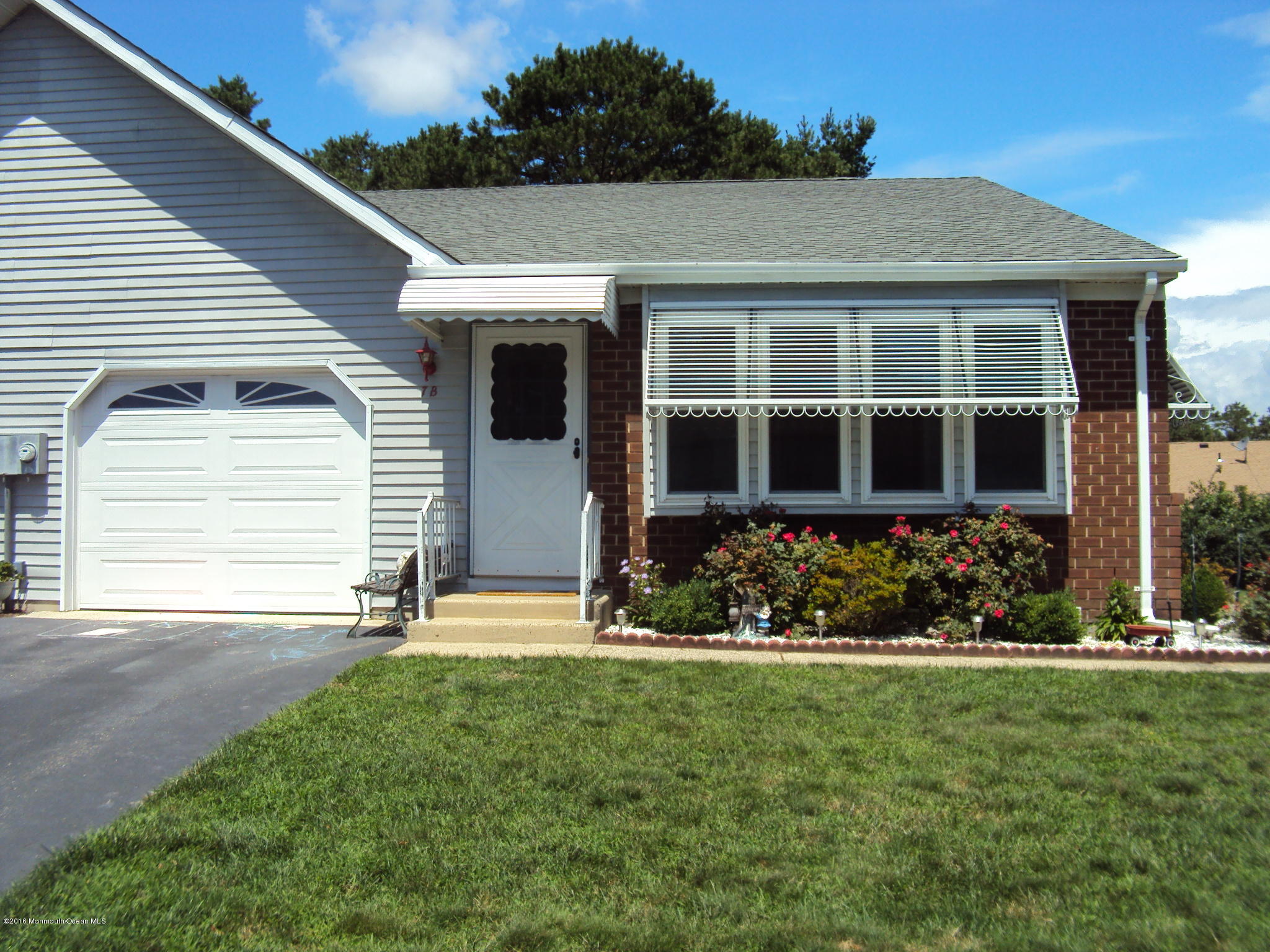 7A Alpine Road, Unit B Whiting, NJ 08759 - Photo 1 of 21 a front view of a house with a garden