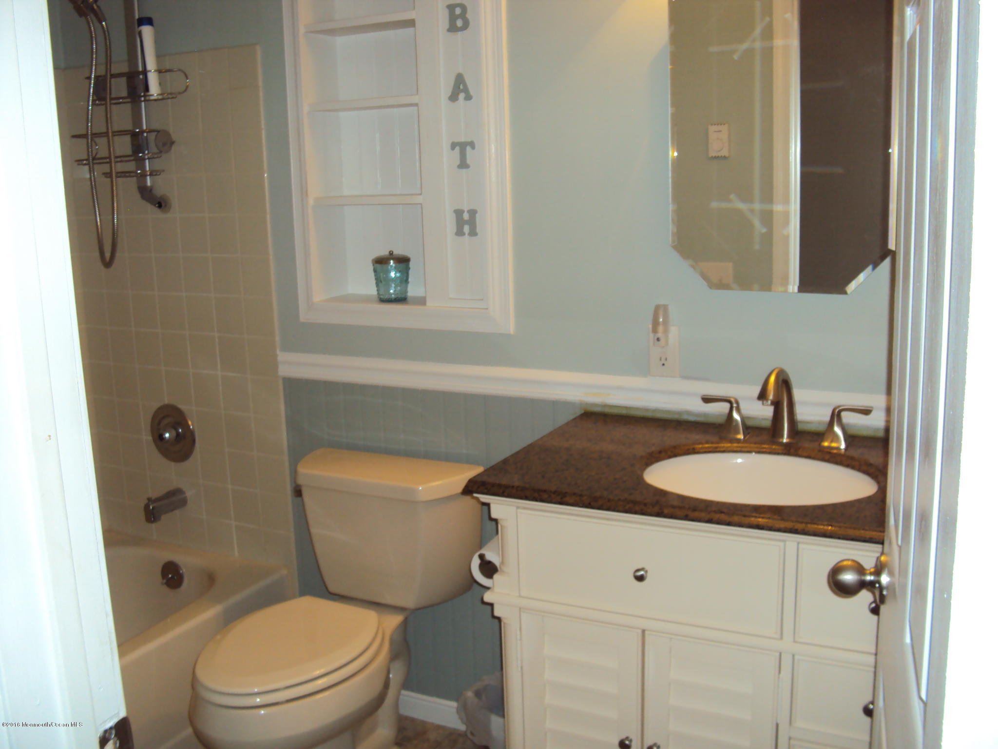 7A Alpine Road, Unit B Whiting, NJ 08759 - Photo 13 of 21 a bathroom with a granite countertop sink toilet a mirror and shower