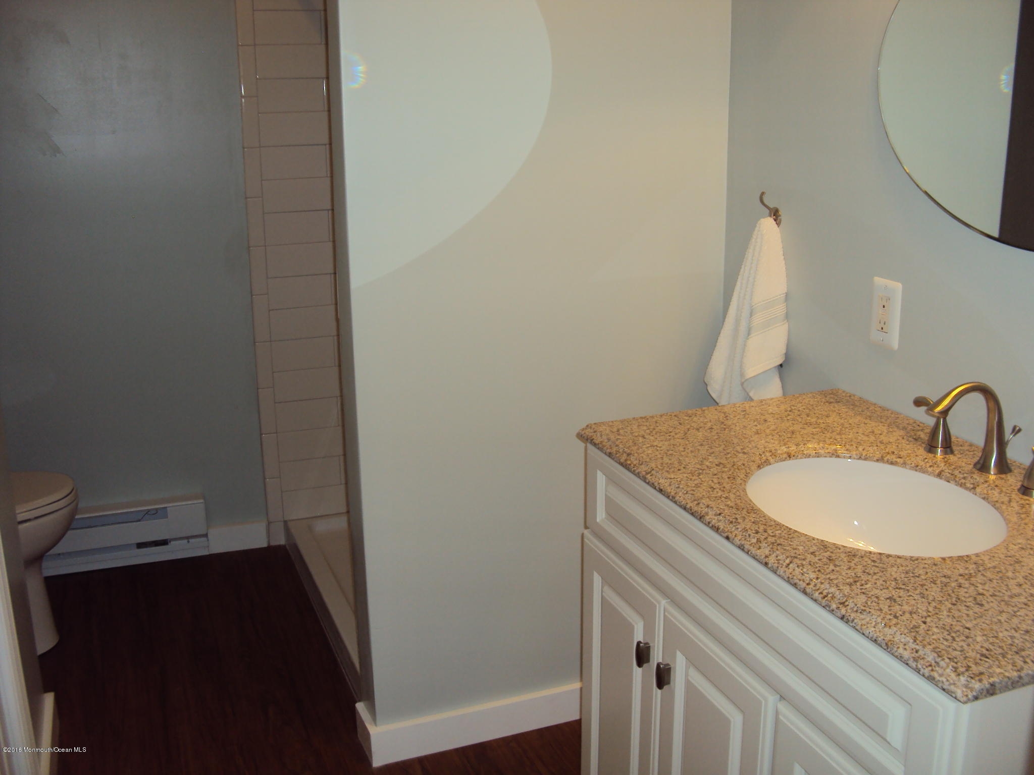 7A Alpine Road, Unit B Whiting, NJ 08759 - Photo 16 of 21 a bathroom with a granite countertop sink and a mirror