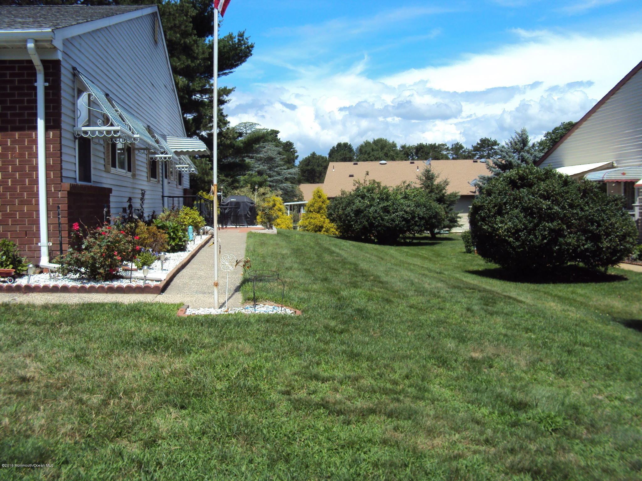 7A Alpine Road, Unit B Whiting, NJ 08759 - Photo 2 of 21 a view of a garden in front of a house