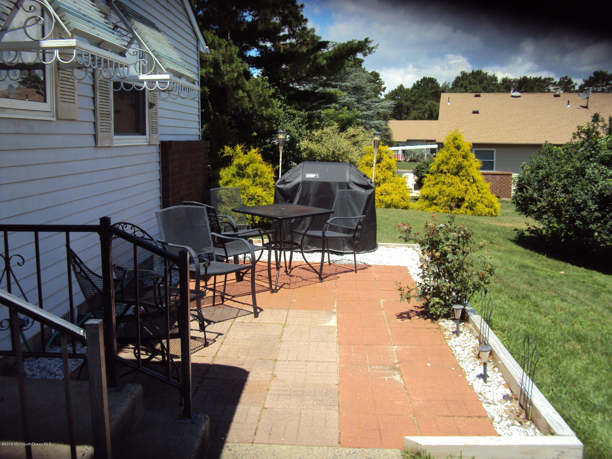 7A Alpine Road, Unit B Whiting, NJ 08759 - Photo 3 of 21 a view of yard from deck having patio