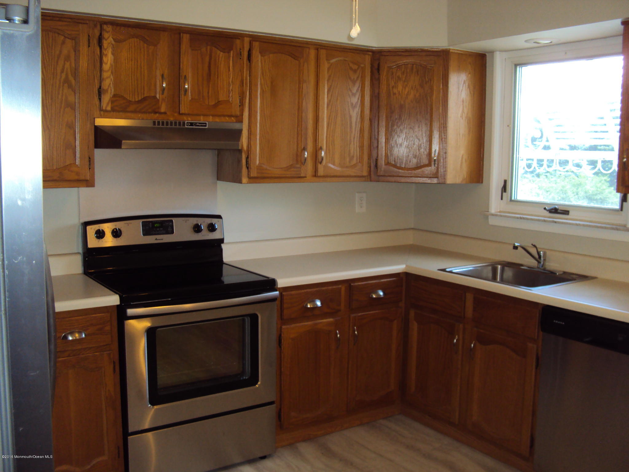 7A Alpine Road, Unit B Whiting, NJ 08759 - Photo 9 of 21 a kitchen with wooden cabinets stove top oven and sink