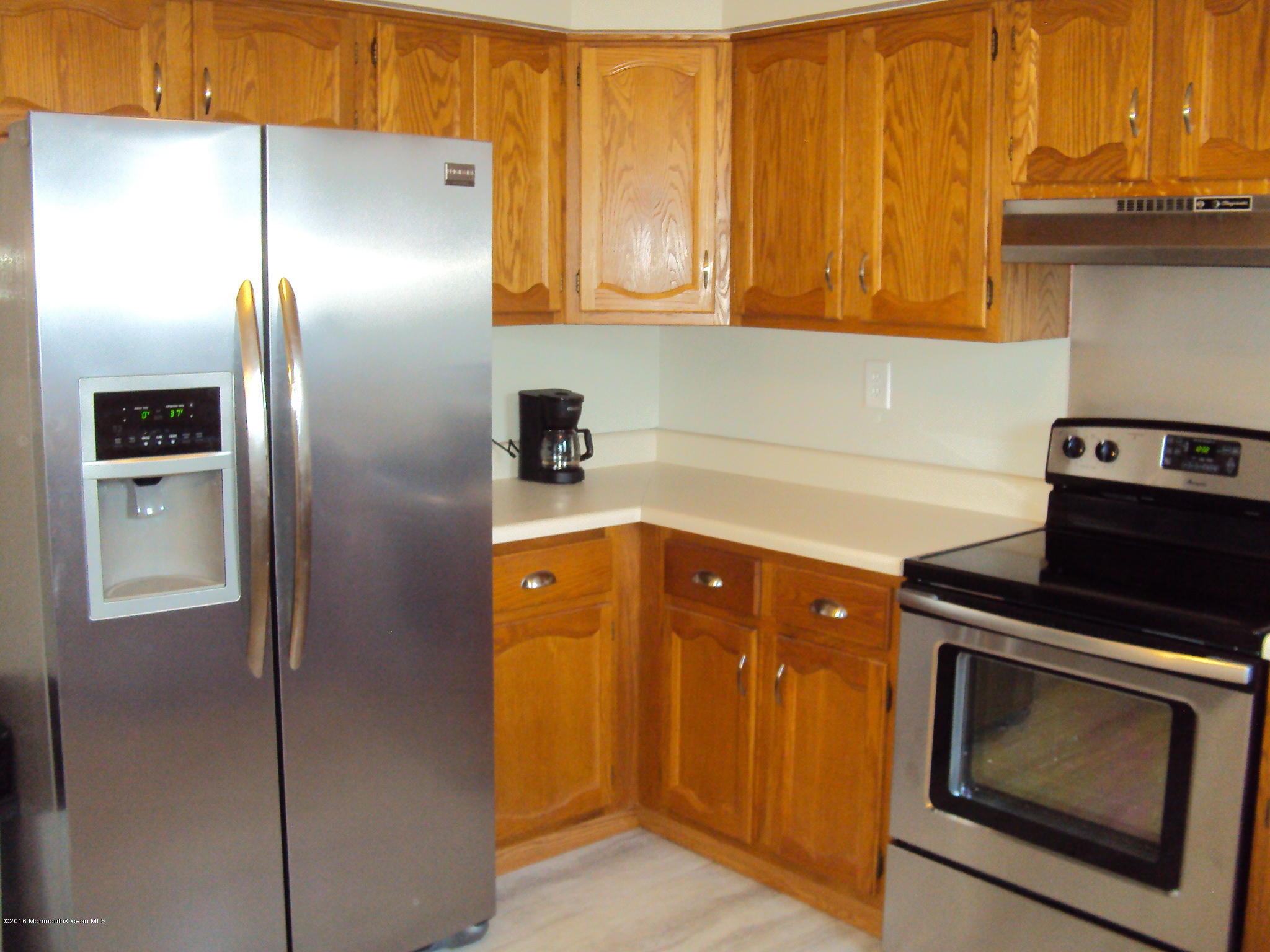 7A Alpine Road, Unit B Whiting, NJ 08759 - Photo 10 of 21 a kitchen with stainless steel appliances granite countertop a refrigerator and a stove