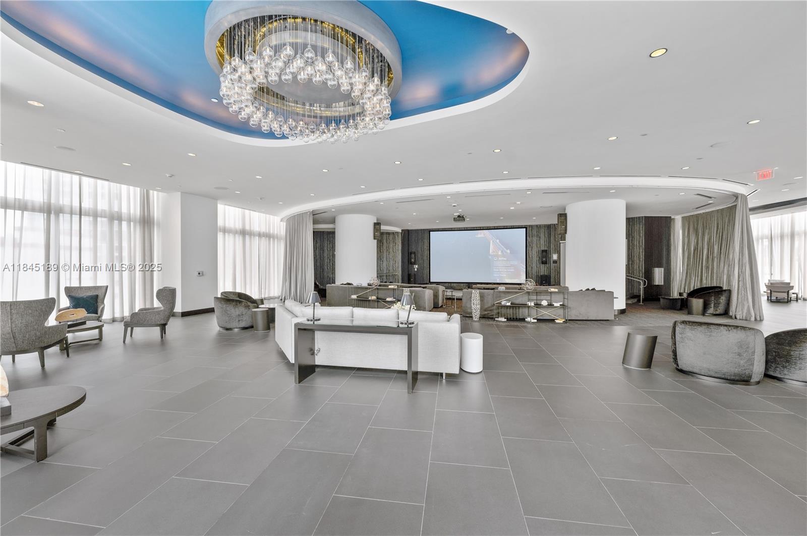 851 Northeast 1st Avenue, Unit 1410 Miami, FL 33132 - Photo 22 of 43 a living room with furniture and a large window