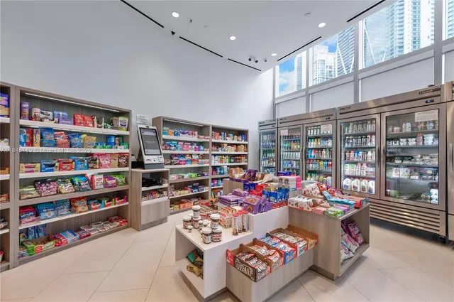 a view of a livingroom with furniture window and wooden floor